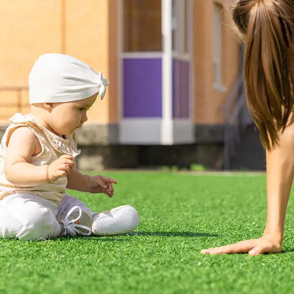 Baby on Backyard Turf Grass